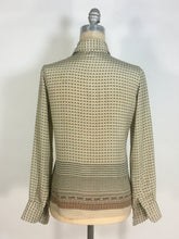 Load image into Gallery viewer, 1970’s silk blouse with Egyptian or Byzantine theme print by Oleg Cassini