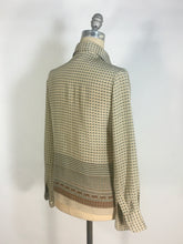 Load image into Gallery viewer, 1970’s silk blouse with Egyptian or Byzantine theme print by Oleg Cassini
