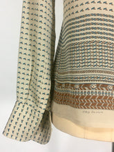 Load image into Gallery viewer, 1970’s silk blouse with Egyptian or Byzantine theme print by Oleg Cassini