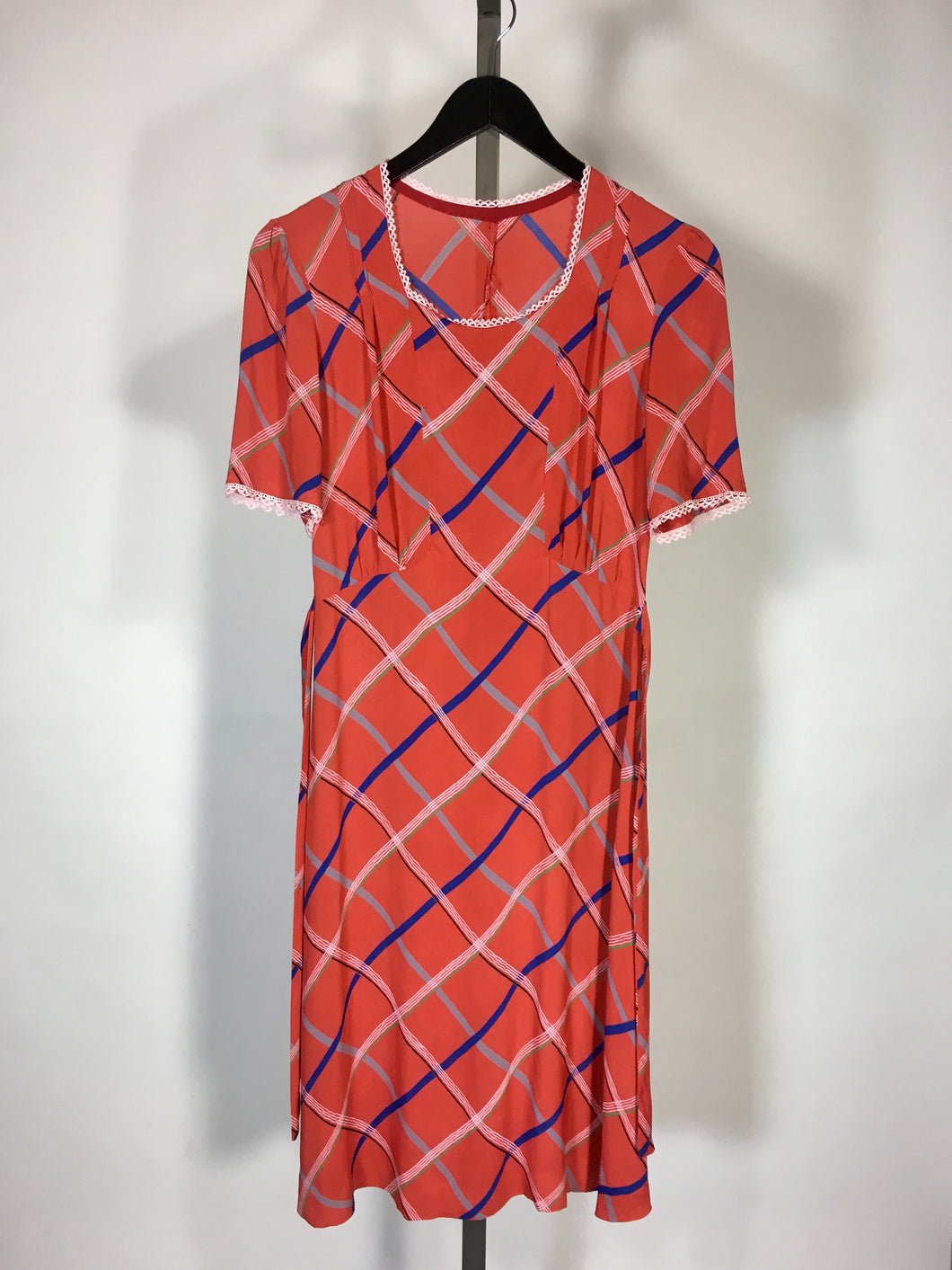 1930’s red-orange check print cold rayon dress with waist sash and lace cuff details