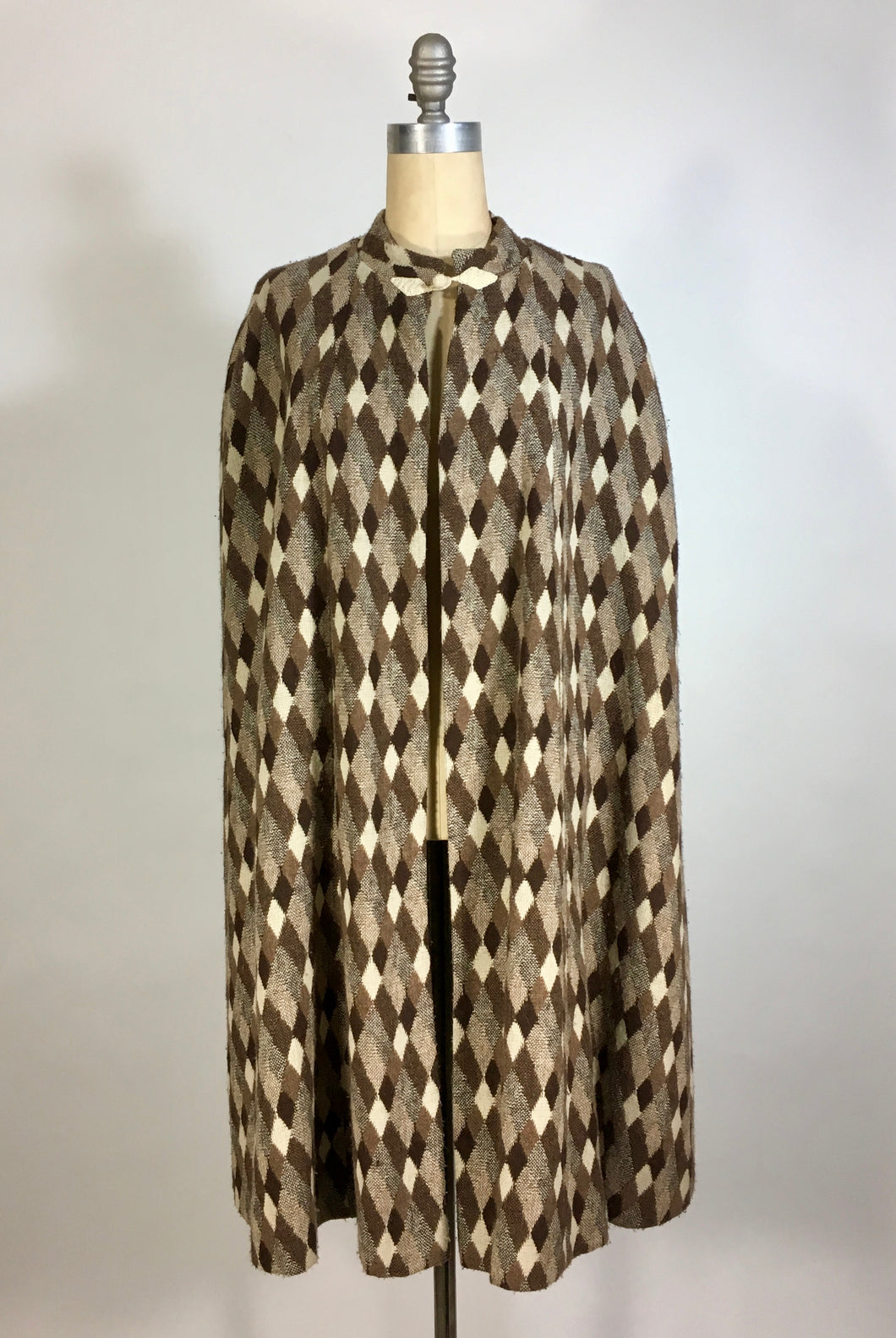 1970’s brown and cream knit diamond check pattern cape by Fran & Chiz