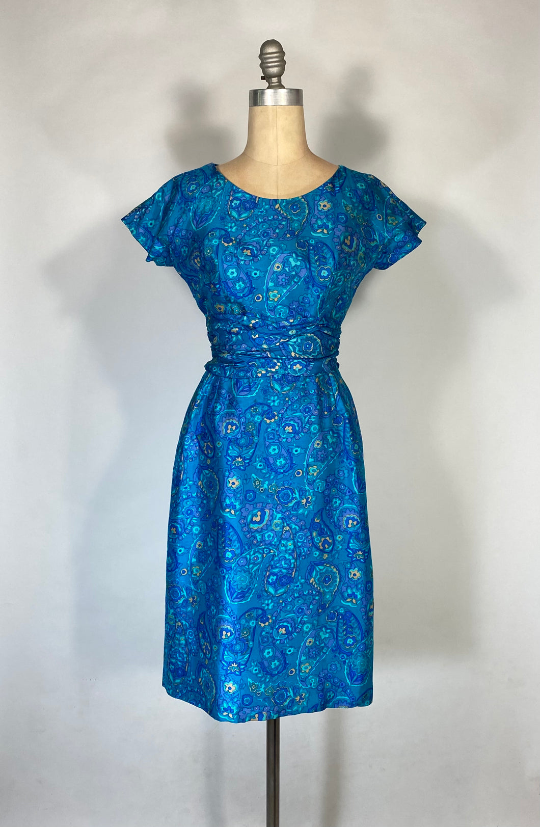 1960’s blue palette paisley silk dress with ruched waist detail by Paul Brook