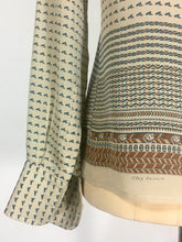 Load image into Gallery viewer, 1970’s silk blouse with Egyptian or Byzantine theme print by Oleg Cassini
