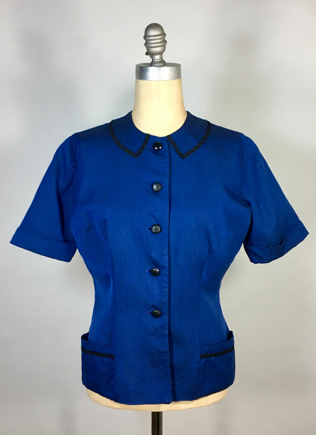1940’s-50’s sapphire blue iridescent blouse with black trim by Georgiana