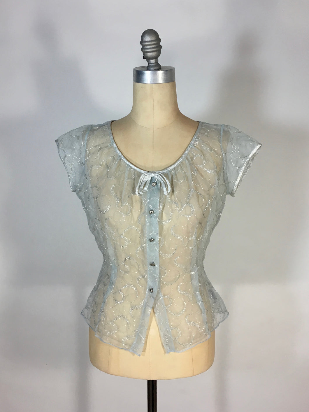 1950’s ice blue and silver sheet lacy nylon blouse with bow detail by Judy Bond