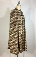Load image into Gallery viewer, 1970’s brown and cream knit diamond check pattern cape by Fran &amp; Chiz
