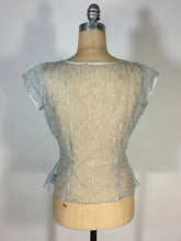 Load image into Gallery viewer, 1950’s ice blue and silver sheet lacy nylon blouse with bow detail by Judy Bond
